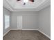 Bright bedroom features neutral walls, carpet, one window, and tray ceiling at 185 Stewart Glen Dr, Covington, GA 30014
