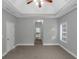 Bedroom boasts neutral walls, plush carpet and ensuite bath entrance at 185 Stewart Glen Dr, Covington, GA 30014