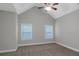 Bright bedroom features neutral walls, carpet, two windows, ceiling fan at 185 Stewart Glen Dr, Covington, GA 30014