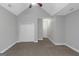 Bright bedroom features neutral walls, carpet, a closet, and entry door at 185 Stewart Glen Dr, Covington, GA 30014