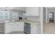 Open-concept kitchen featuring ample counter space, stainless steel appliances, and natural lighting at 185 Stewart Glen Dr, Covington, GA 30014