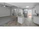 An open kitchen and living room floor plan featuring modern appliances and eat in bar at 185 Stewart Glen Dr, Covington, GA 30014