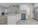 Kitchen island in an open kitchen and living room concept featuring white cabinets at 185 Stewart Glen Dr, Covington, GA 30014