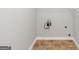 Unfinished laundry room features tile floor, outlets and plumbing at 185 Stewart Glen Dr, Covington, GA 30014