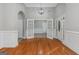 Bright room with hardwood floors, white trim, and double french doors at 185 Stewart Glen Dr, Covington, GA 30014