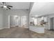 Spacious living room showcasing neutral décor, stylish columns, and direct access to the adjacent, well-lit kitchen at 185 Stewart Glen Dr, Covington, GA 30014