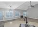 A bright open concept space with stainless steel appliances and a fireplace at 185 Stewart Glen Dr, Covington, GA 30014