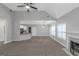 Open concept living area with a fireplace, eat in kitchen, and adjacent to a dining area at 185 Stewart Glen Dr, Covington, GA 30014