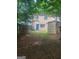 View of the backyard showing a shed and a blue door at 5579 Marbut Rd, Lithonia, GA 30058