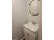 Bathroom with white vanity, new light fixture, and modern finishes at 5579 Marbut Rd, Lithonia, GA 30058