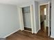 Bedroom features wood look flooring and bi-fold closet doors at 5579 Marbut Rd, Lithonia, GA 30058