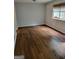 Bright bedroom with wood floors, a window, and neutral paint at 5579 Marbut Rd, Lithonia, GA 30058