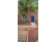 Charming brick townhouse with a blue door and beautiful yard at 5579 Marbut Rd, Lithonia, GA 30058