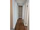 Hallway with laminate wood flooring and a closet at 5579 Marbut Rd, Lithonia, GA 30058