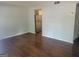 Inviting living room featuring wood floors, neutral walls, and plenty of natural light at 5579 Marbut Rd, Lithonia, GA 30058