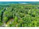 A home surrounded by a lush green forest, offering a tranquil and private setting at 5525 Belle Meade Dr, Villa Rica, GA 30180