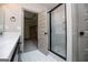 The bathroom showcases a glass-enclosed shower, vanity, and stylish finishes at 5525 Belle Meade Dr, Villa Rica, GA 30180