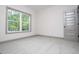 Bright, carpeted bedroom with natural light from large window; gray trim at 5525 Belle Meade Dr, Villa Rica, GA 30180
