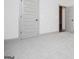 Neutral bedroom featuring light gray walls, carpet, and trim, plus a painted door at 5525 Belle Meade Dr, Villa Rica, GA 30180