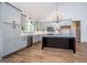 Kitchen boasts stainless steel appliances, granite countertops, island, and soft-close cabinets at 5525 Belle Meade Dr, Villa Rica, GA 30180