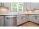 This bright kitchen has stainless steel appliances, granite countertops, and a window view at 5525 Belle Meade Dr, Villa Rica, GA 30180