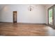 Bright and spacious living room features hardwood floors, base molding, and ample natural light at 5525 Belle Meade Dr, Villa Rica, GA 30180