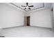 Spacious main bedroom featuring plush carpeting and a modern ceiling fan at 5525 Belle Meade Dr, Villa Rica, GA 30180