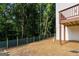 View of the backyard showcasing a privacy fence and natural surroundings at 2328 Lakewood Ave Sw, Atlanta, GA 30315