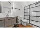 Modern bathroom with gray vanity and tiled shower at 2328 Lakewood Ave Sw, Atlanta, GA 30315