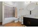 Bathroom with modern vanity, gold fixtures, and tiled shower at 2328 Lakewood Ave Sw, Atlanta, GA 30315