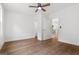 Bright, spacious bedroom with wood-look floors, ceiling fan, and white walls at 2328 Lakewood Ave Sw, Atlanta, GA 30315
