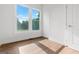 Bedroom with hardwood floors, white walls, and large windows at 2328 Lakewood Ave Sw, Atlanta, GA 30315