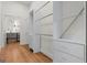 Walk-in closet with white shelving, drawers, and rods at 2328 Lakewood Ave Sw, Atlanta, GA 30315