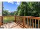 Spacious wooden deck overlooking lush greenery and offering a serene outdoor living space at 2328 Lakewood Ave Sw, Atlanta, GA 30315