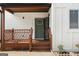 Charming front porch with wooden railings, a green front door, and white trim at 2328 Lakewood Ave Sw, Atlanta, GA 30315