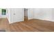 Hallway with hardwood floors and white doors at 2328 Lakewood Ave Sw, Atlanta, GA 30315