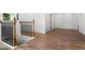 Hallway with hardwood floors, white walls, and modern railing at 2328 Lakewood Ave Sw, Atlanta, GA 30315