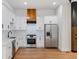 Modern kitchen with white cabinets, stainless steel appliances, and hardwood floors at 2328 Lakewood Ave Sw, Atlanta, GA 30315