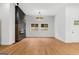 Spacious living room featuring modern lighting, fireplace, and large windows with natural light at 2328 Lakewood Ave Sw, Atlanta, GA 30315