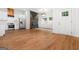 Bright living room with hardwood floors, a modern fireplace, and a kitchen with stainless steel appliances at 2328 Lakewood Ave Sw, Atlanta, GA 30315