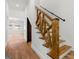 Staircase featuring wood and white trim and a decorative wood banister at 2328 Lakewood Ave Sw, Atlanta, GA 30315