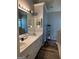 Bright bathroom with double vanity, white cabinets, and modern lighting, offering ample space and storage at 740 Pebble Blvd, Covington, GA 30016