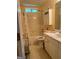 Bathroom featuring a tub with a shower, white vanity, cabinet, and neutral colored walls at 740 Pebble Blvd, Covington, GA 30016