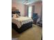 Bedroom with carpet, ceiling fan, large bed with neutral bedding, and natural light from a window at 740 Pebble Blvd, Covington, GA 30016