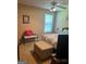 Cozy bedroom with neutral walls, carpet, a ceiling fan, and a bright window offering natural light at 740 Pebble Blvd, Covington, GA 30016