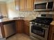 Well-equipped kitchen with stainless steel appliances and plenty of counter space for meal preparation at 740 Pebble Blvd, Covington, GA 30016