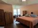 Spacious main bedroom with a ceiling fan, a large bed, and lots of natural light from multiple windows at 740 Pebble Blvd, Covington, GA 30016