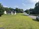 Charming home with a well-maintained lawn and a picturesque street view in a peaceful neighborhood at 740 Pebble Blvd, Covington, GA 30016