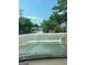 Street view of Pebble Brooke's entrance, showcasing manicured landscaping and inviting neighborhood charm at 740 Pebble Blvd, Covington, GA 30016