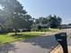 Neighborhood street view showcasing well-manicured lawns and houses, with a home at 740 visible at 740 Pebble Blvd, Covington, GA 30016